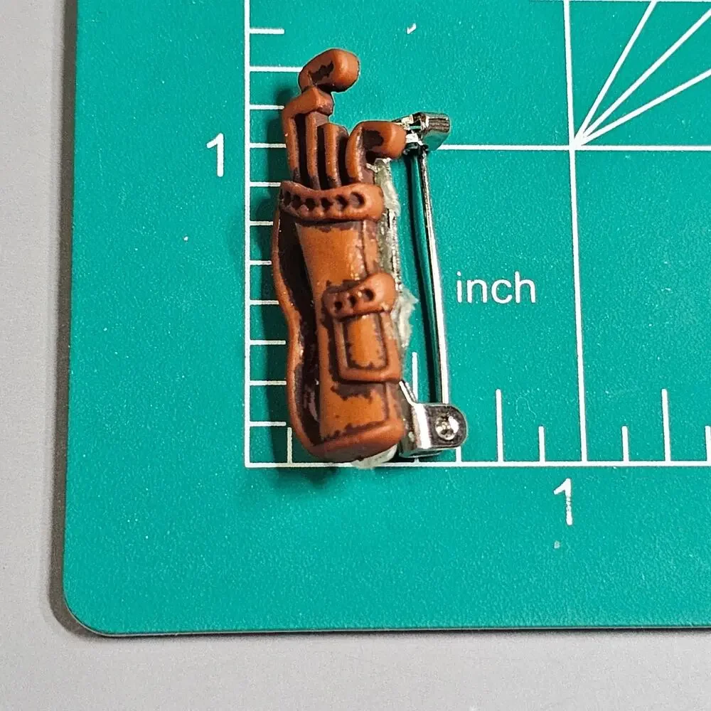 Unbranded check shipment brooch